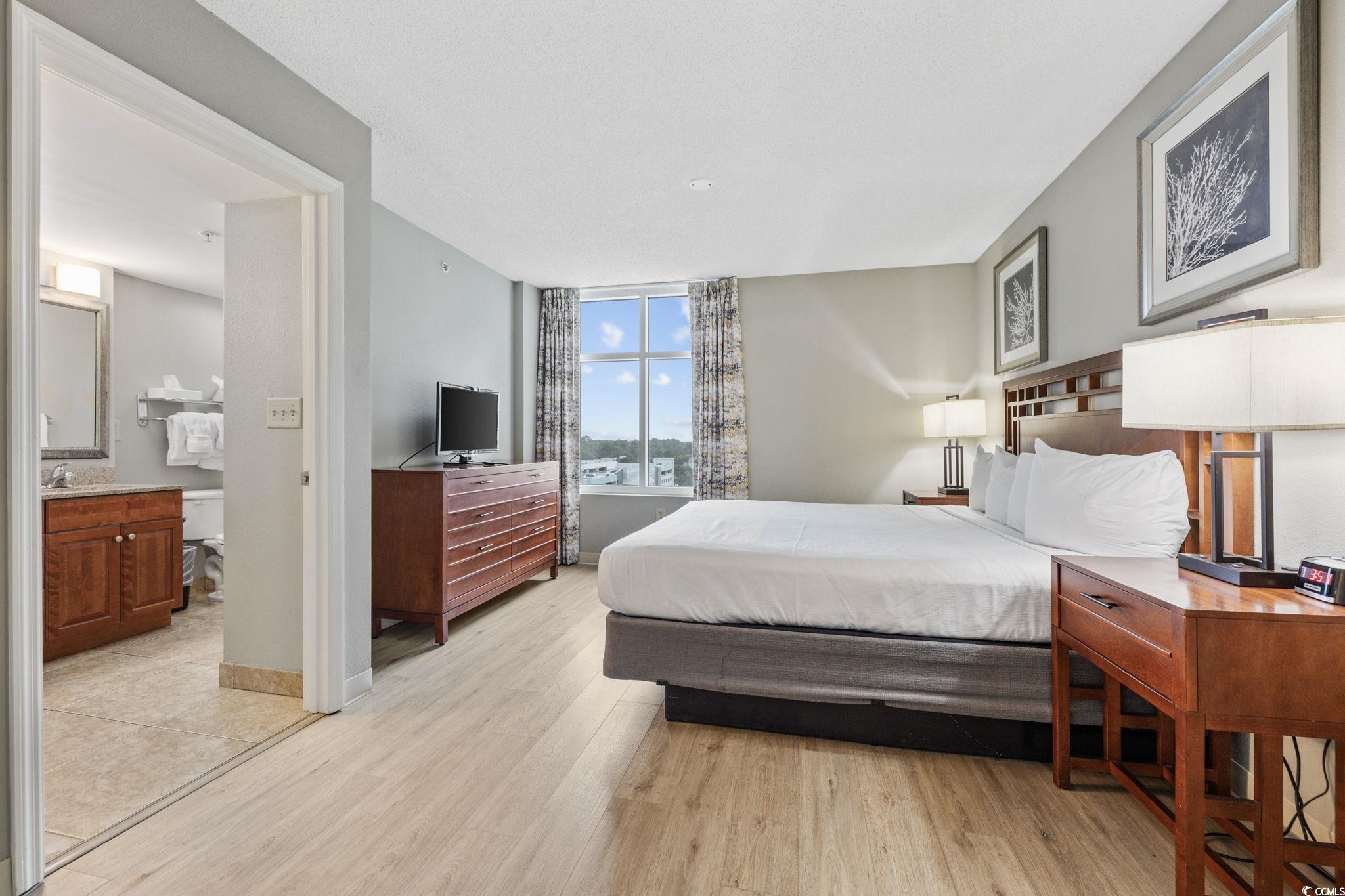 5200 North Ocean Boulevard, Unit 857 Myrtle Beach, SC 29577 - Photo 14 of 40 Bedroom featuring light wood-style flooring and baseboards