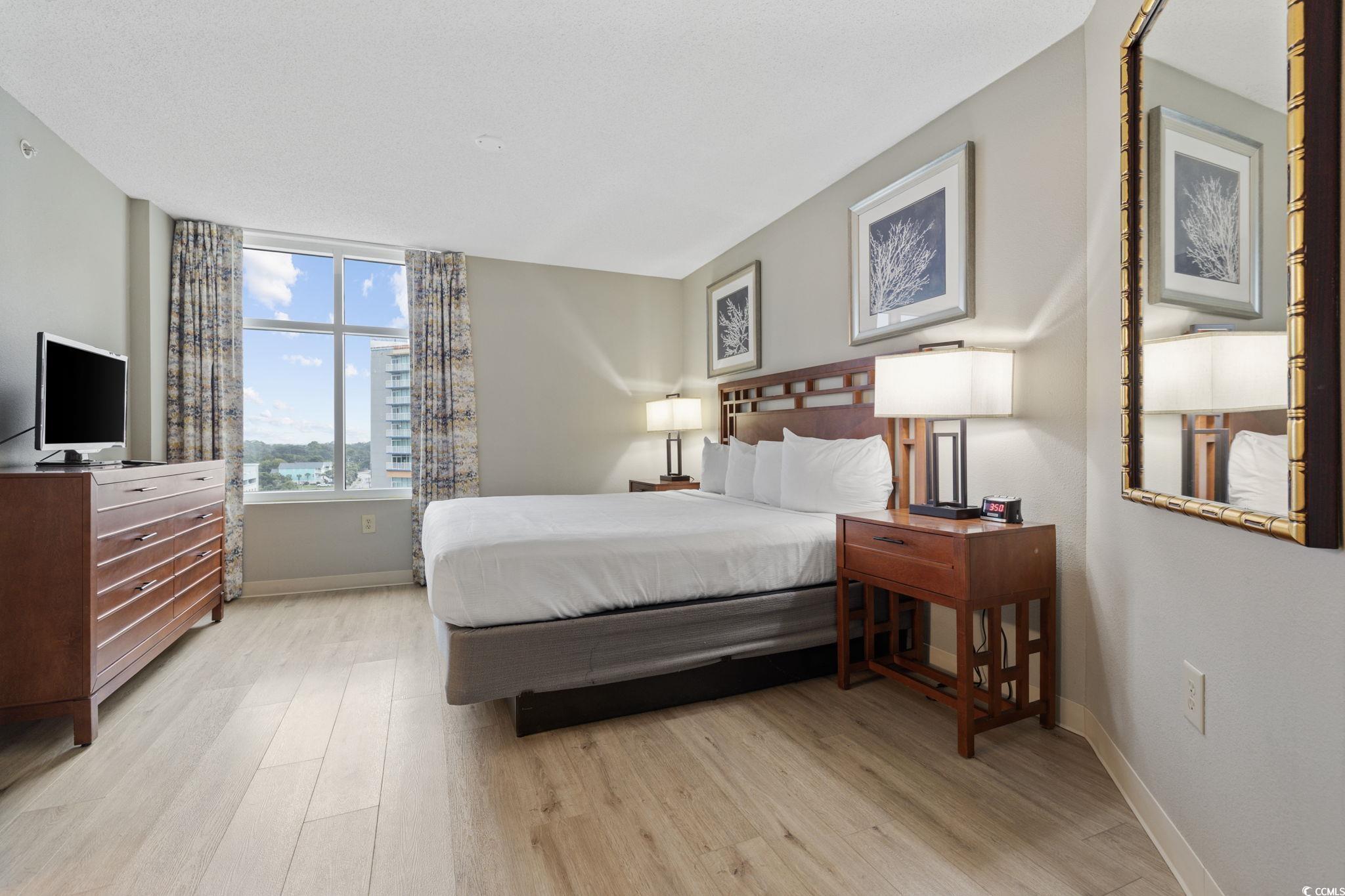 5200 North Ocean Boulevard, Unit 857 Myrtle Beach, SC 29577 - Photo 16 of 40 Bedroom featuring wood finished floors