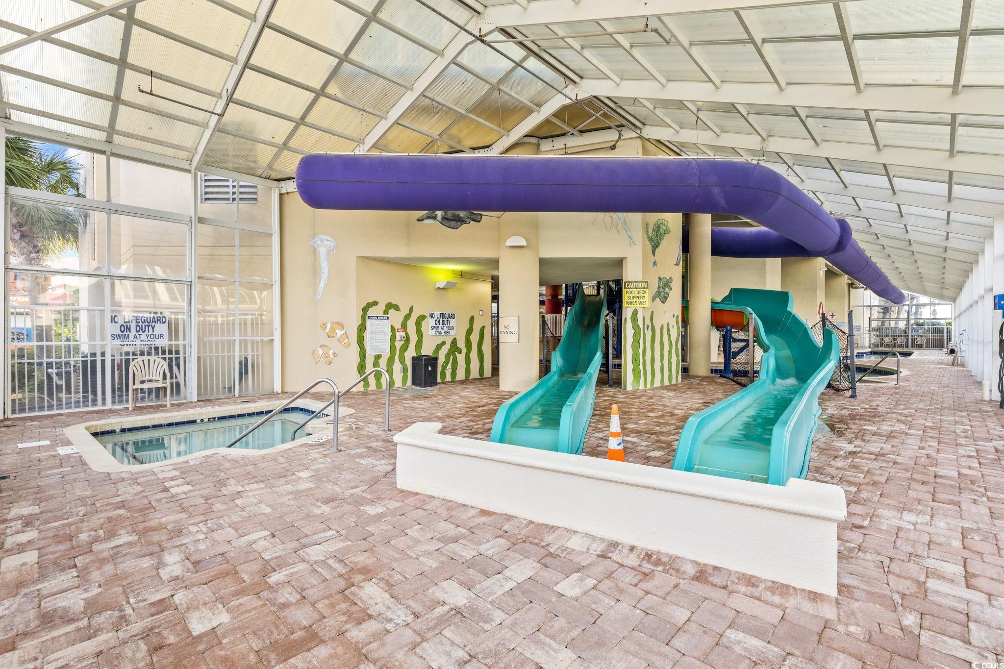 5200 North Ocean Boulevard, Unit 857 Myrtle Beach, SC 29577 - Photo 29 of 40 Community playground featuring a hot tub