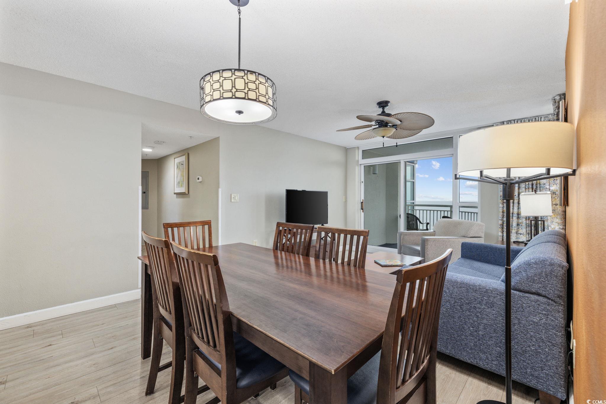 5200 North Ocean Boulevard, Unit 857 Myrtle Beach, SC 29577 - Photo 3 of 40 Dining space featuring a ceiling fan and light wood-style floors