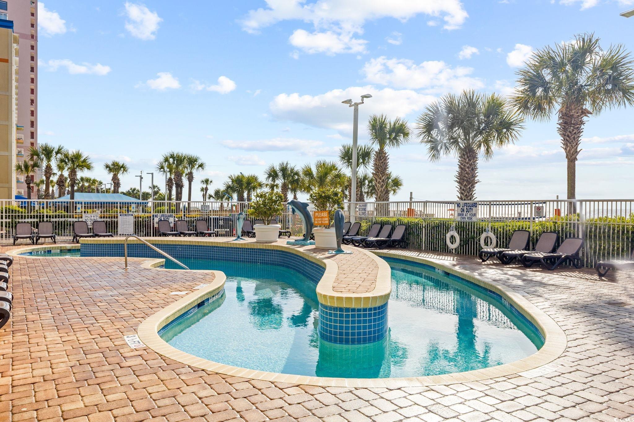 5200 North Ocean Boulevard, Unit 857 Myrtle Beach, SC 29577 - Photo 34 of 40 Community pool featuring a patio area