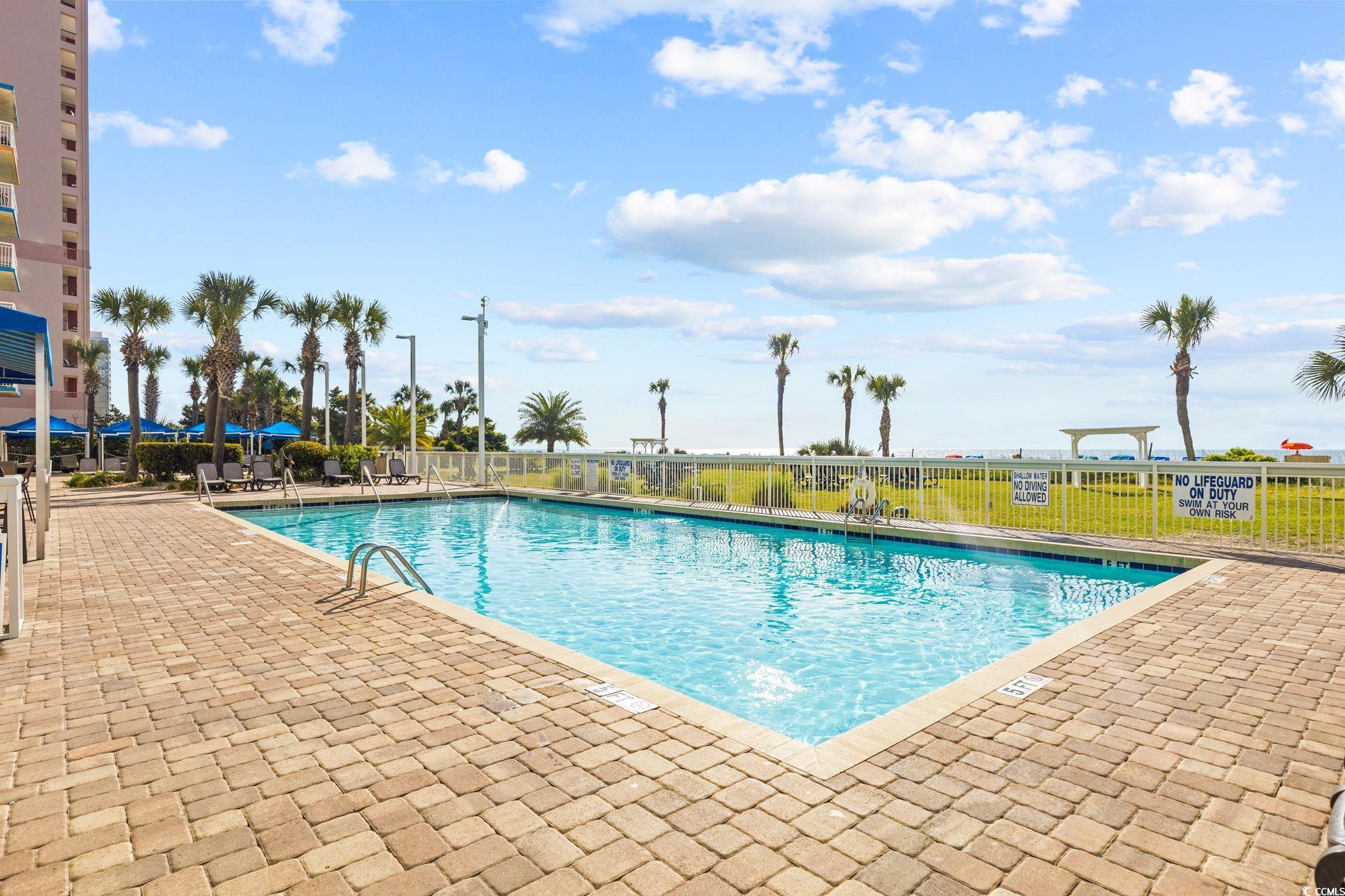 5200 North Ocean Boulevard, Unit 857 Myrtle Beach, SC 29577 - Photo 36 of 40 Community pool featuring a patio area