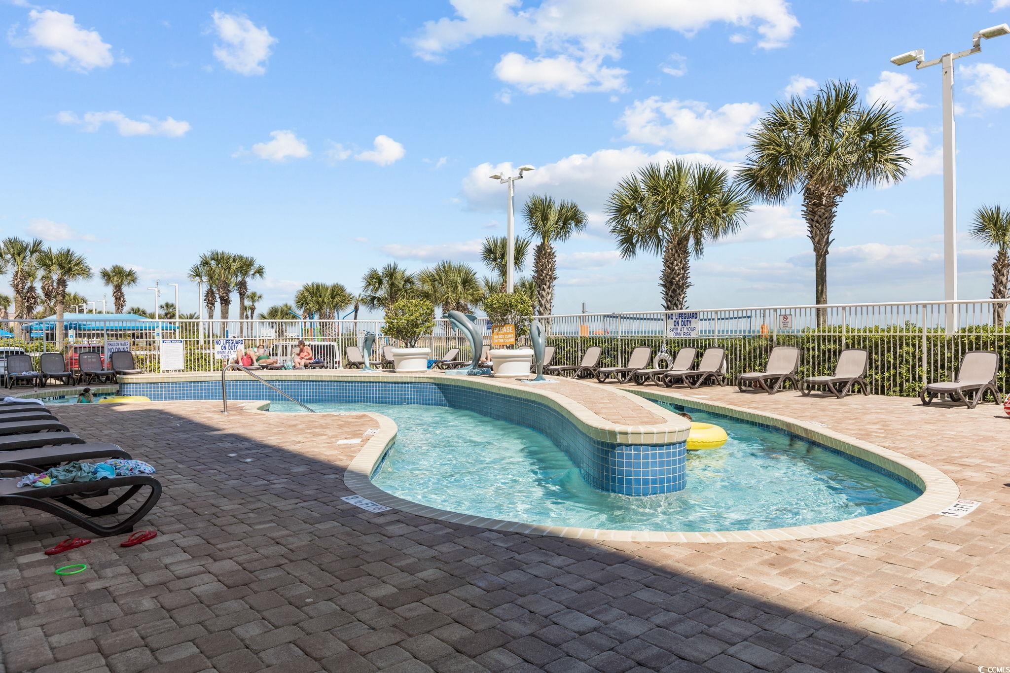 5200 North Ocean Boulevard, Unit 857 Myrtle Beach, SC 29577 - Photo 37 of 40 Community pool featuring a patio area