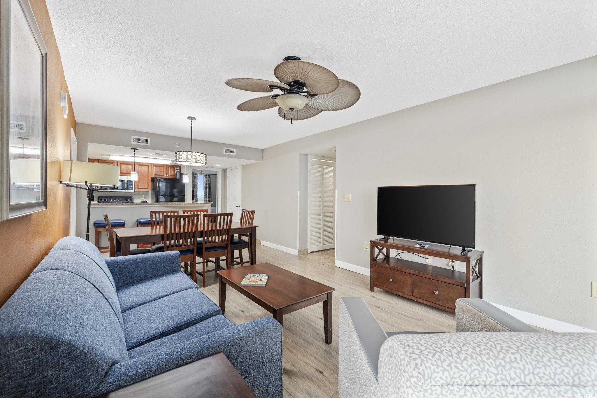 5200 North Ocean Boulevard, Unit 857 Myrtle Beach, SC 29577 - Photo 4 of 40 Living room with light wood-style floors and a ceiling fan