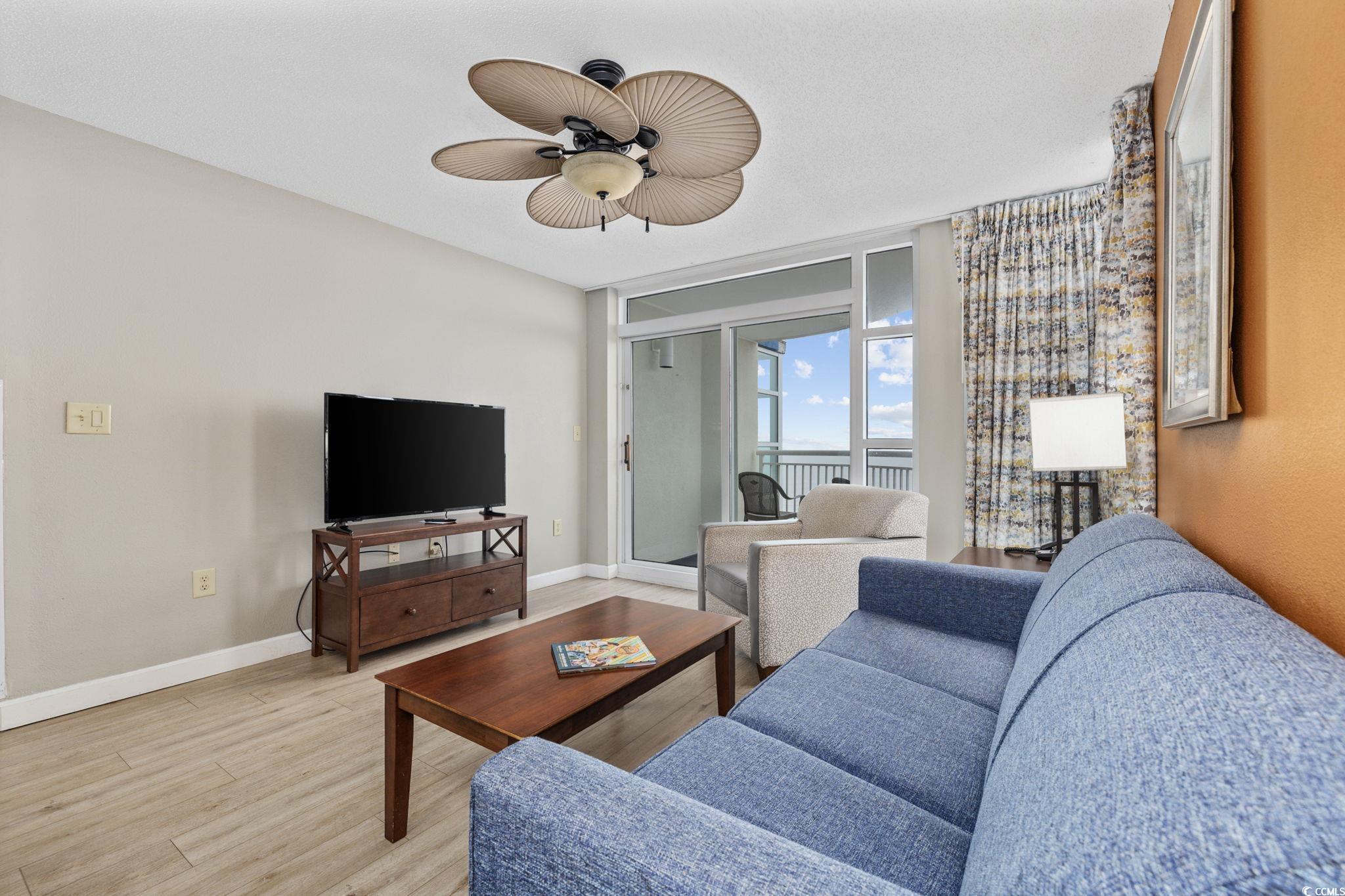 5200 North Ocean Boulevard, Unit 857 Myrtle Beach, SC 29577 - Photo 5 of 40 Living area featuring light wood-style floors and a ceiling fan