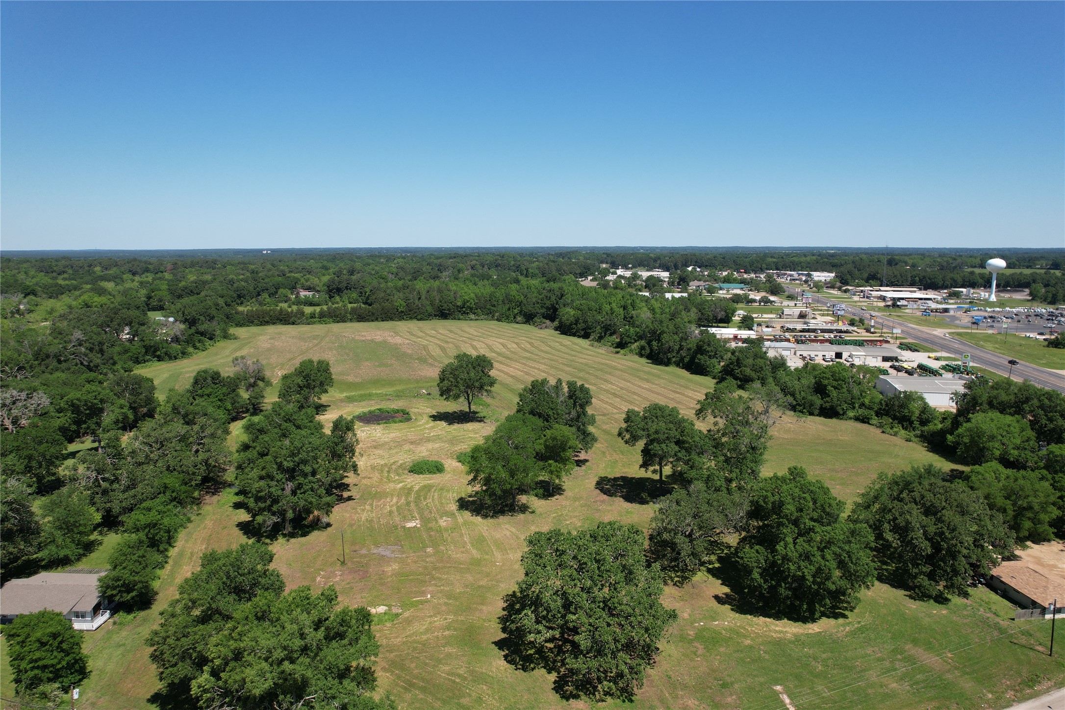 304 East / Joe Kale Road Crockett, TX 75835 - Photo 9 of 21 an aerial view of a residential houses with outdoor space and trees