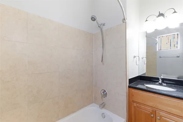 a view of staircase with railing and white walls