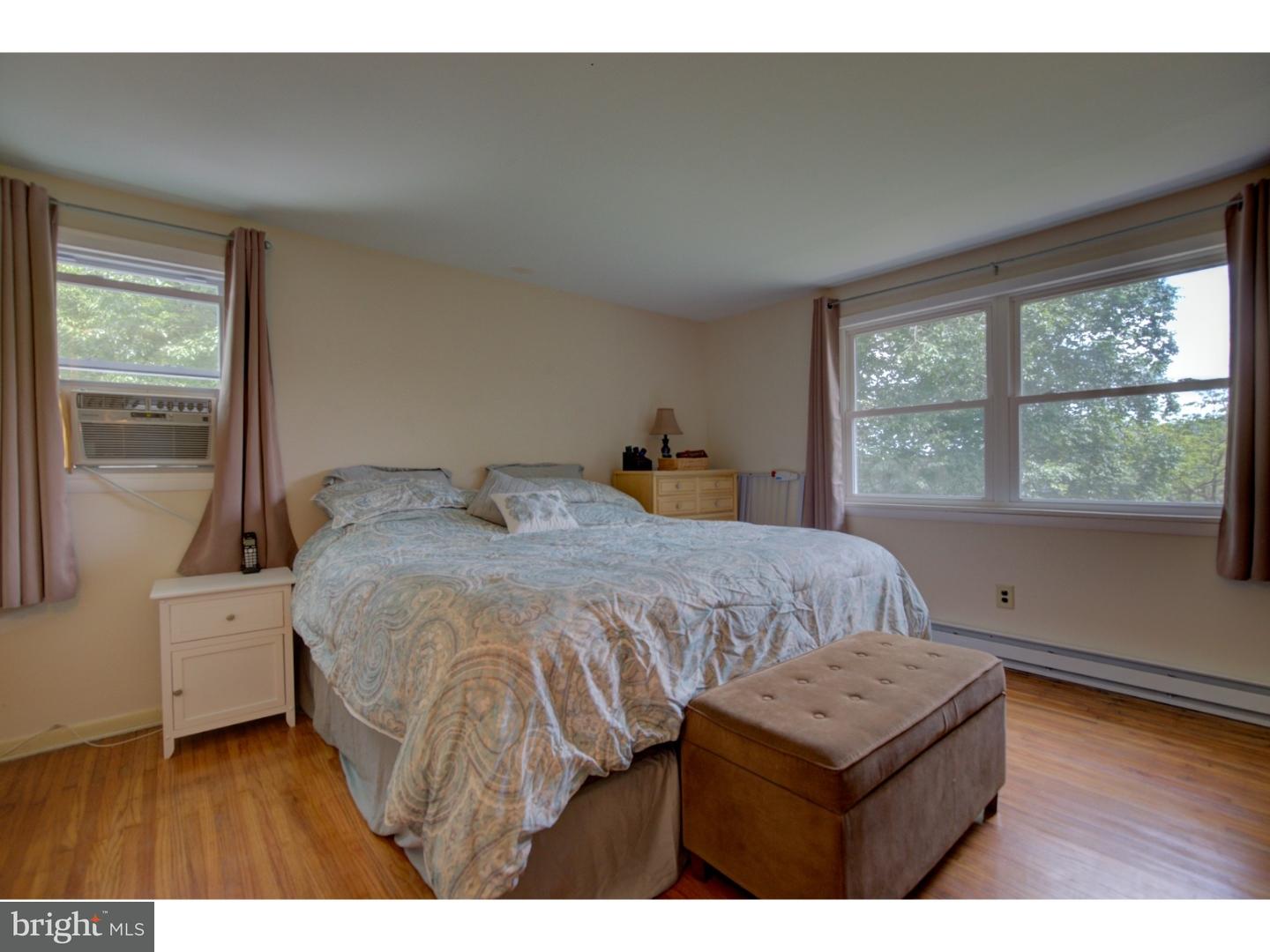 1397 Valley View Road Pottstown, PA 19465 - Photo 14 of 25 a bedroom with a bed window and a night stand