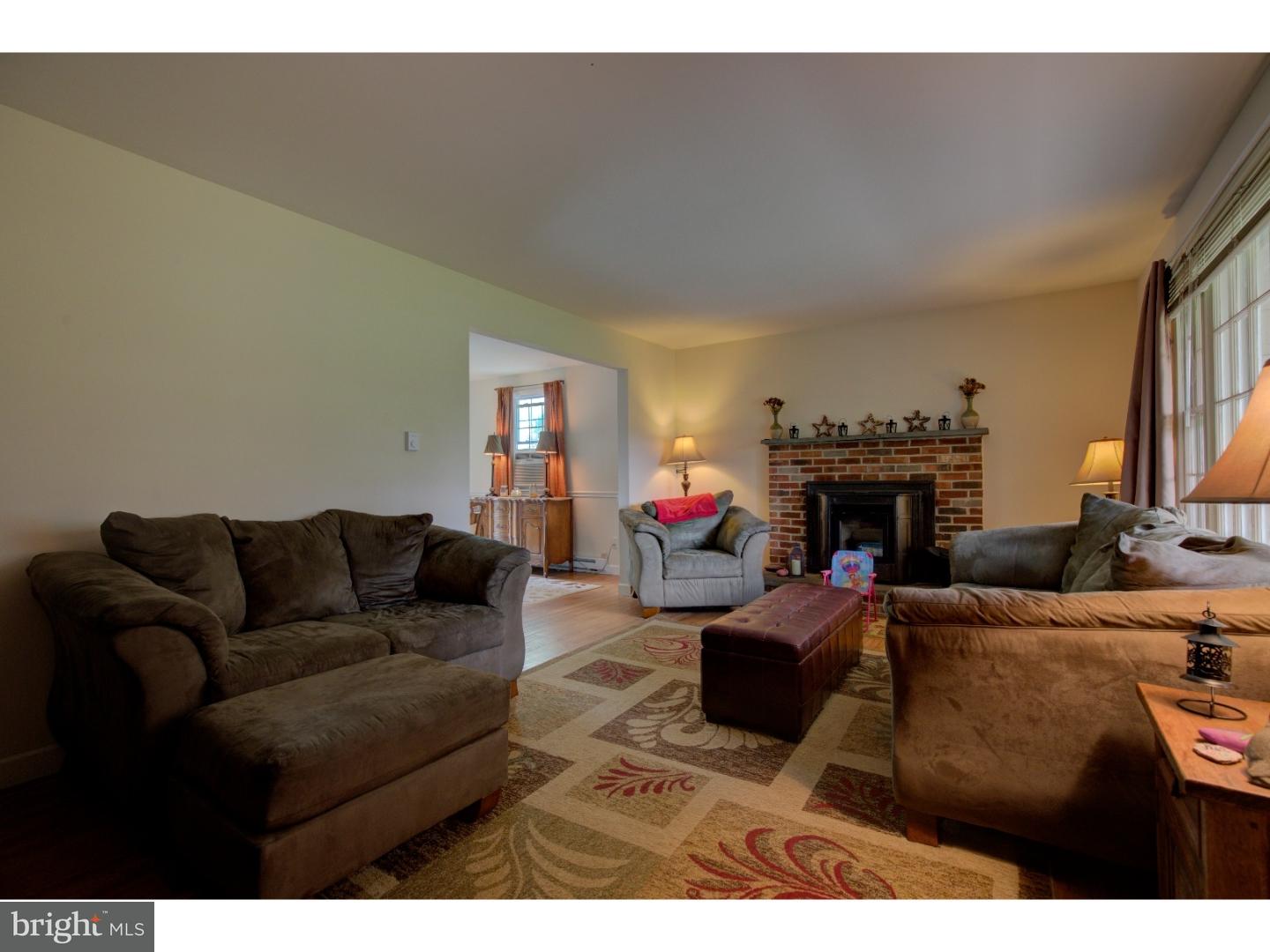 1397 Valley View Road Pottstown, PA 19465 - Photo 3 of 25 a living room with furniture a fireplace and a flat screen tv