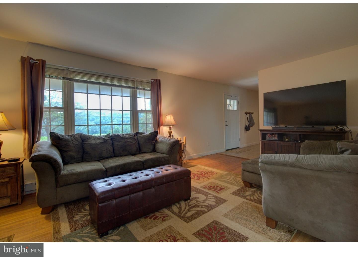 1397 Valley View Road Pottstown, PA 19465 - Photo 5 of 25 a living room with furniture and a flat screen tv