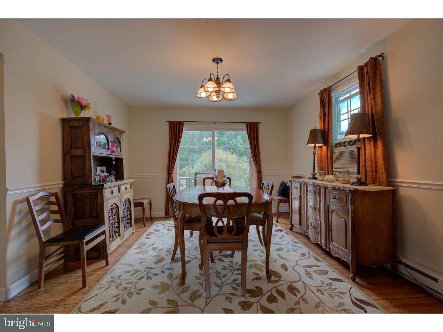 1397 Valley View Road Pottstown, PA 19465 - Photo 6 of 25 a view of a dining room with furniture window and wooden floor