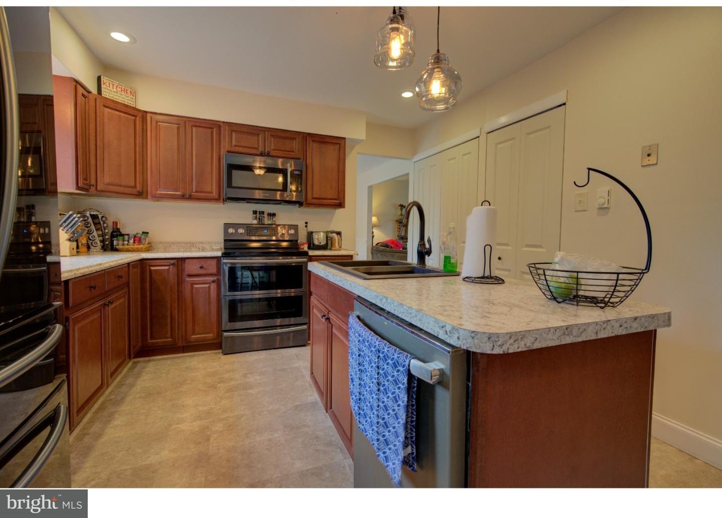 1397 Valley View Road Pottstown, PA 19465 - Photo 9 of 25 a kitchen with stainless steel appliances granite countertop a sink stove and refrigerator