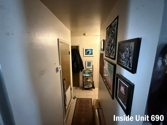 a bathroom with a sink a toilet a mirror and shower