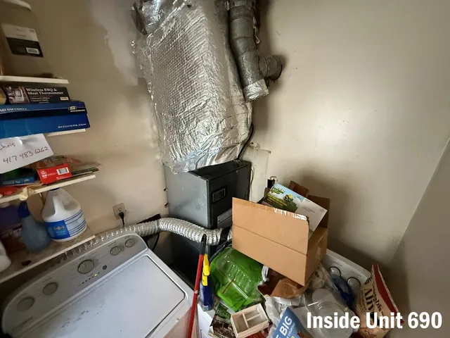 a bedroom with a bed and flat screen tv