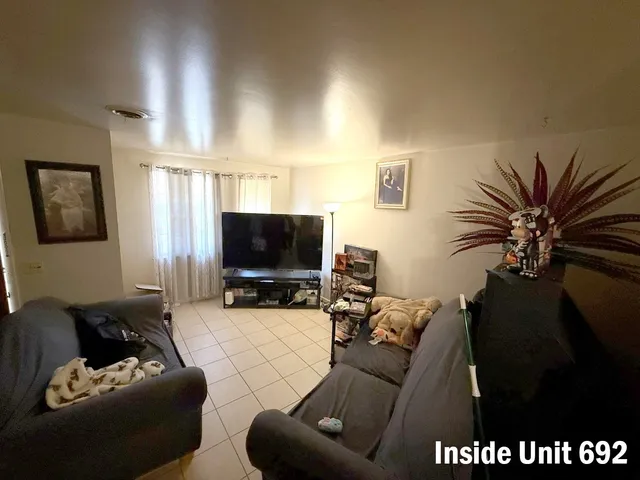 a kitchen with refrigerator and window