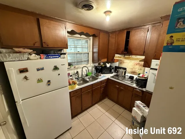 a bathroom with a sink toilet and mirror
