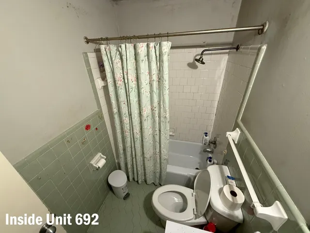 a bedroom with bed and window