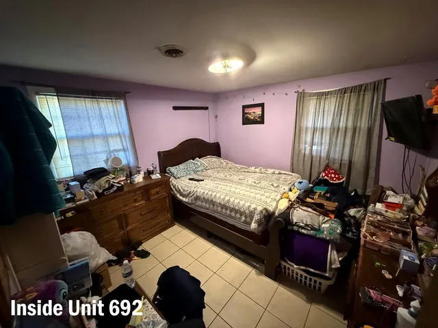 a bedroom with a bed and dresser