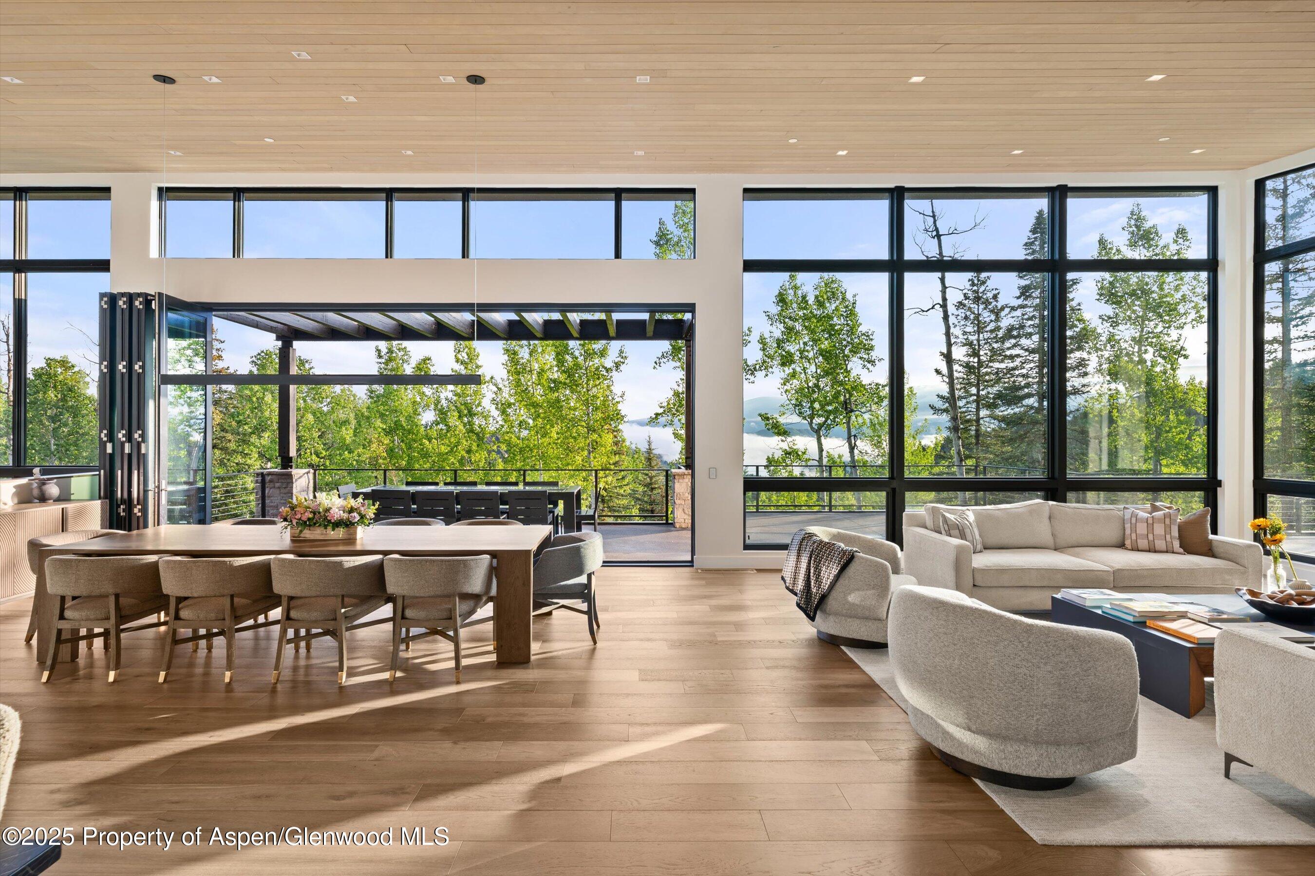 1234 Wood Road Snowmass Village, CO 81615 - Photo 12 of 66 a living room with furniture and a large window