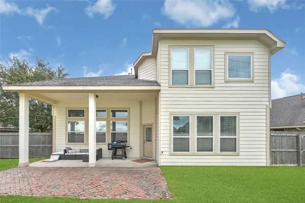 a view of a front of a house with a yard