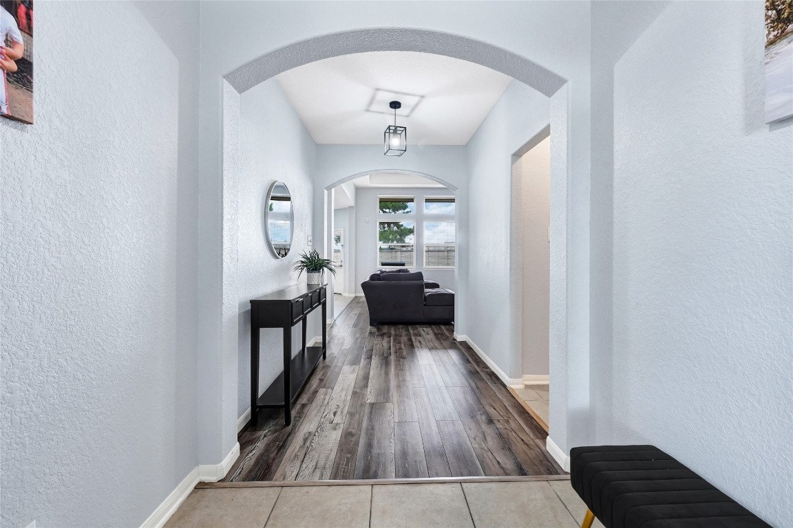 1501 Kent Valley Lane Rosenberg, TX 77471 - Photo 6 of 27 a view of a hallway view with wooden floor and staircase