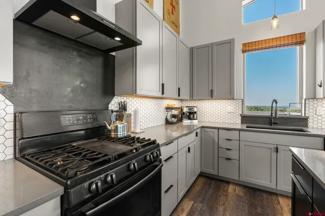 a kitchen with a stove and a sink