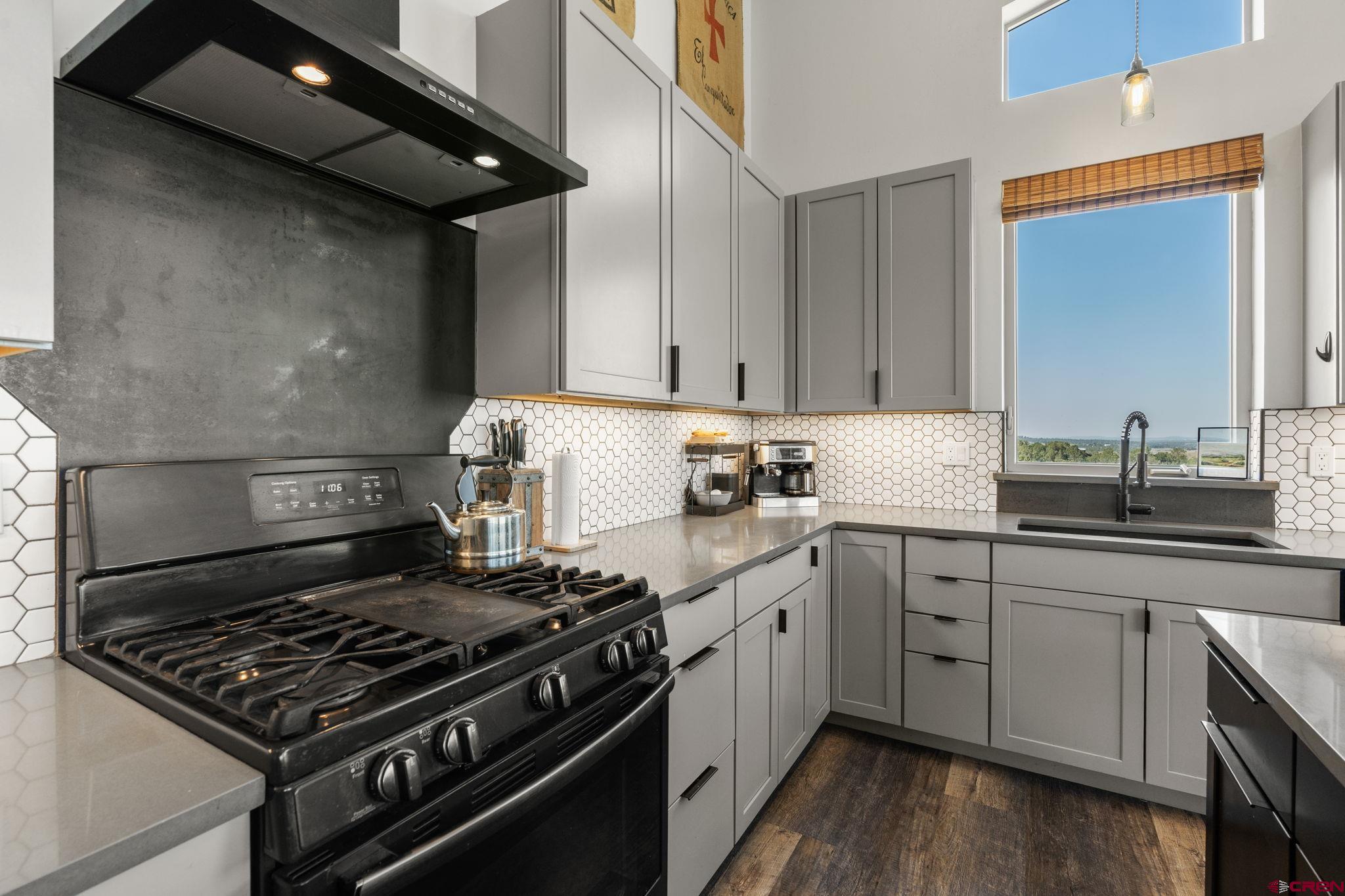 68 Cody Road Durango, CO 81303 - Photo 11 of 45 a kitchen with a stove and a sink