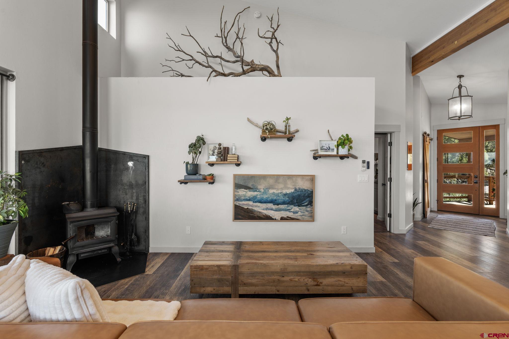 68 Cody Road Durango, CO 81303 - Photo 12 of 45 a living room with furniture and a fireplace