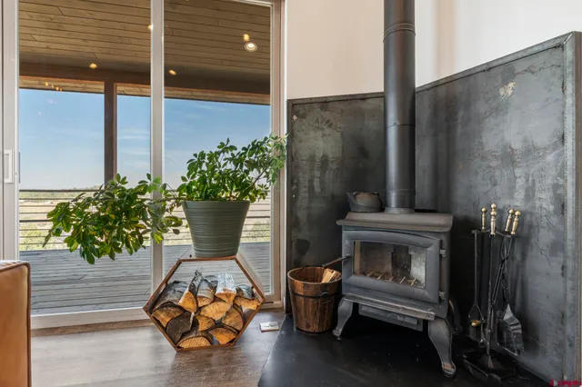 a building outdoor space with patio furniture and potted plants