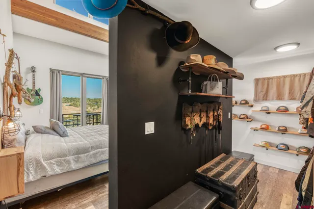 a bedroom with wooden floor