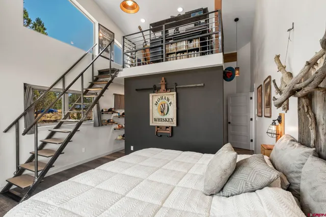 a bedroom with bed and cabinets