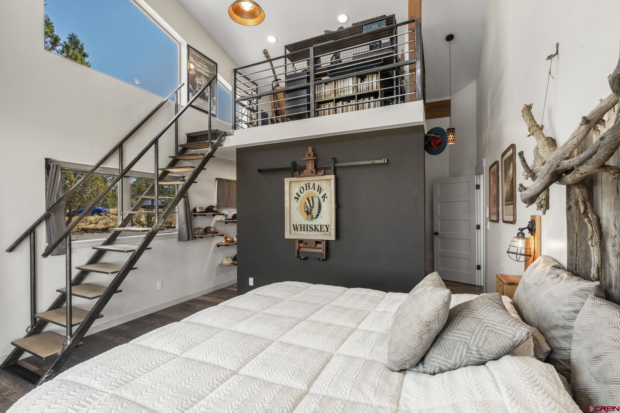 68 Cody Road Durango, CO 81303 - Photo 16 of 45 a bedroom with bed and cabinets