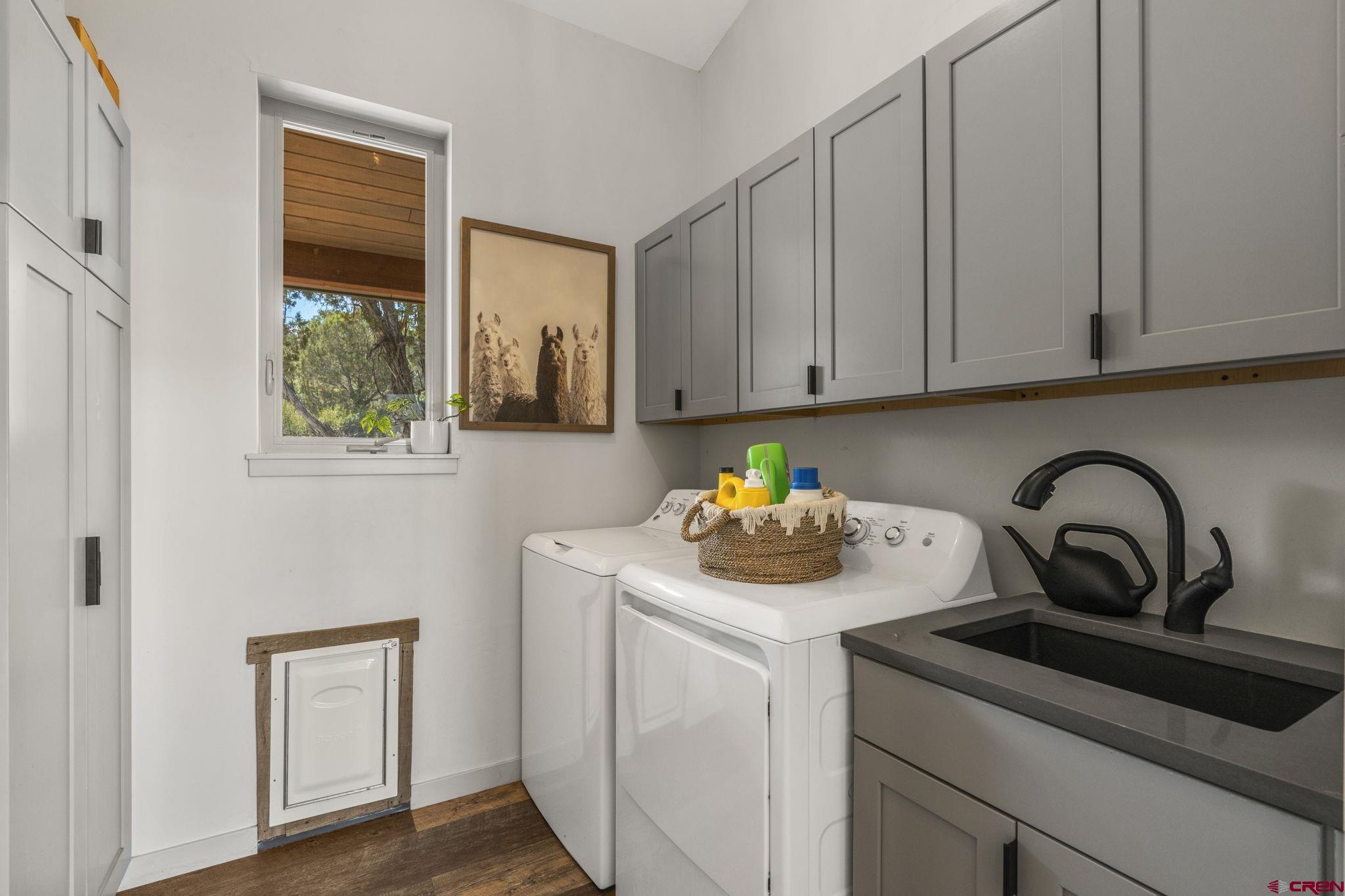68 Cody Road Durango, CO 81303 - Photo 20 of 45 a kitchen with a sink a stove and cabinets