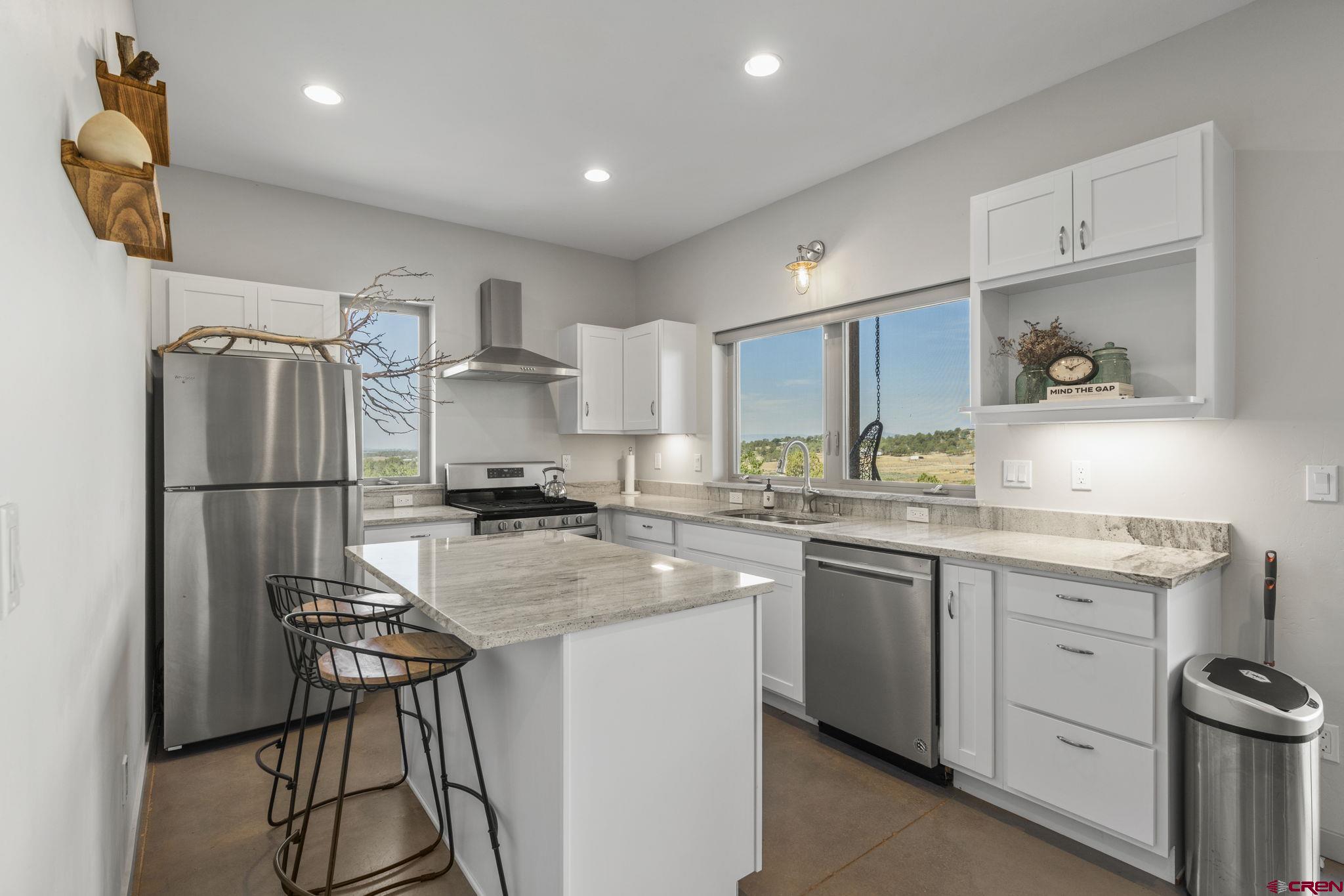68 Cody Road Durango, CO 81303 - Photo 24 of 45 a kitchen with a sink stainless steel appliances and cabinets