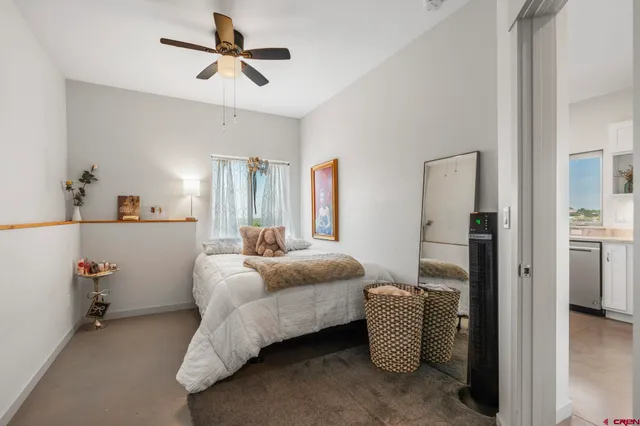 a bedroom with furniture and a chandelier