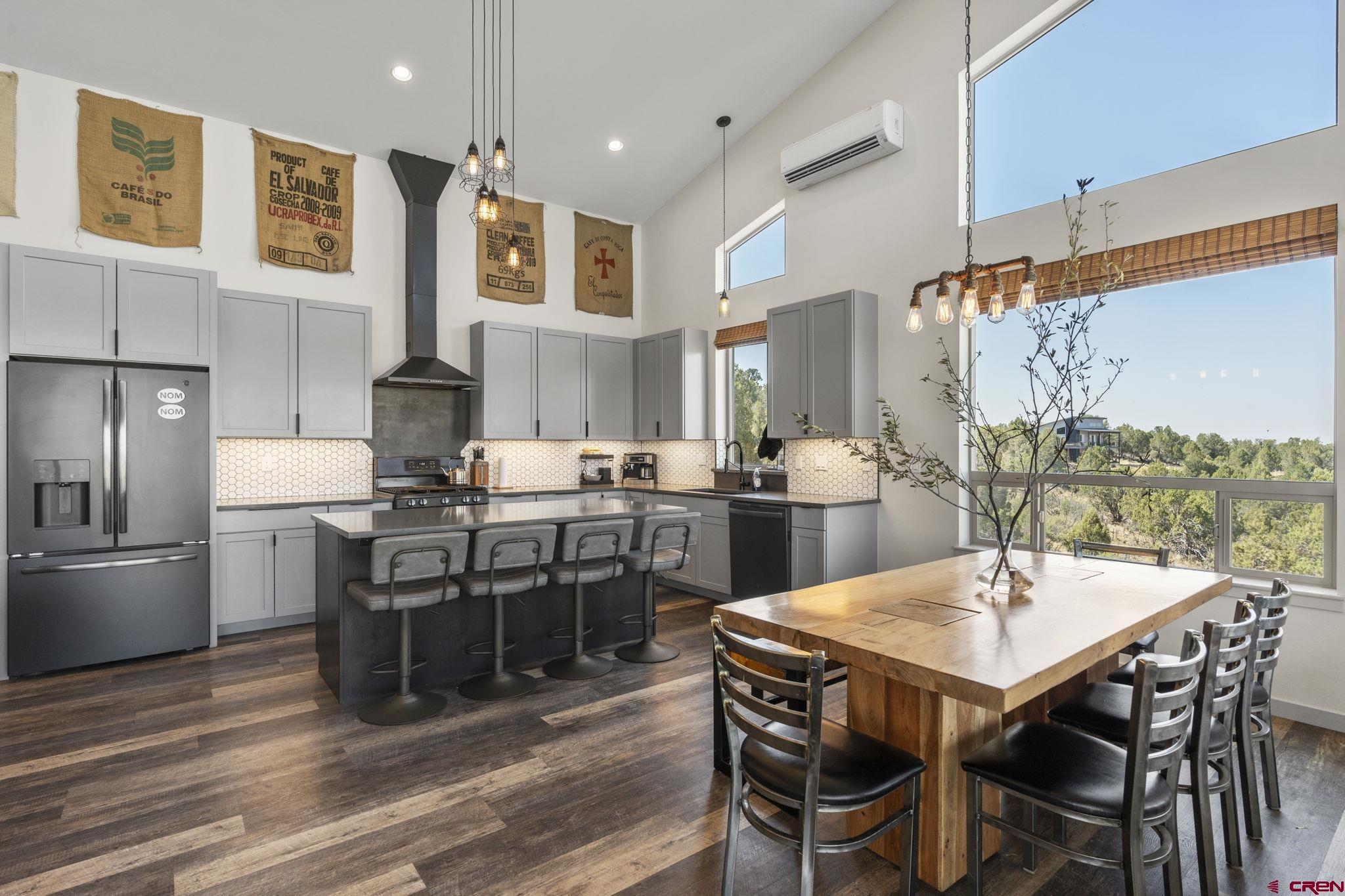 68 Cody Road Durango, CO 81303 - Photo 3 of 45 a kitchen with a dining table chairs and refrigerator