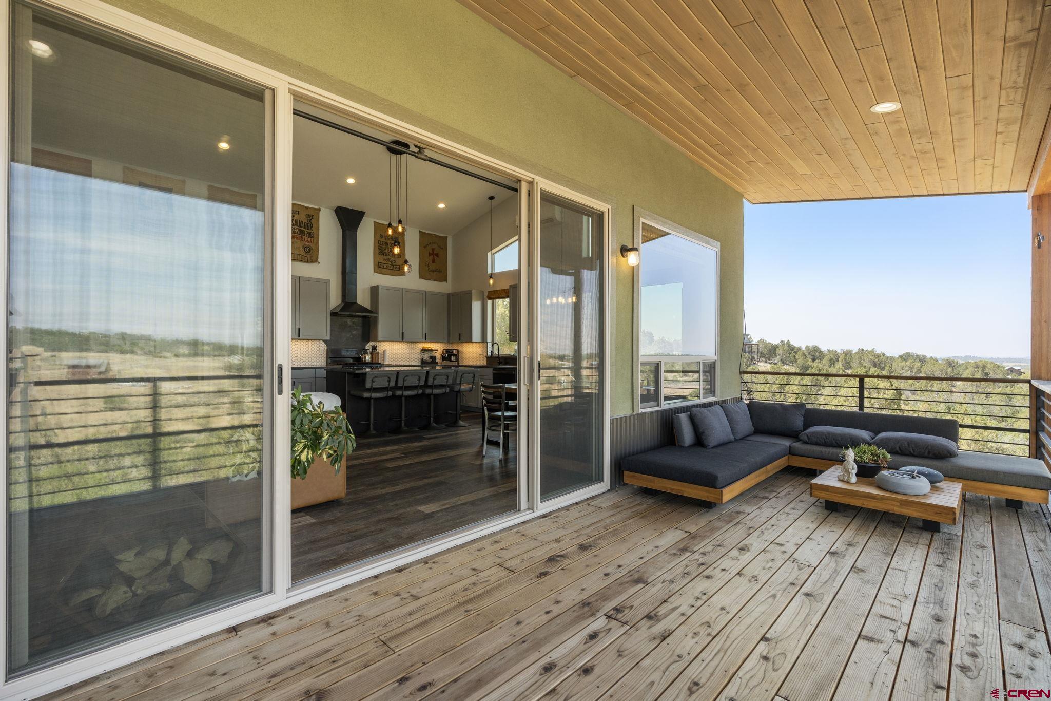 68 Cody Road Durango, CO 81303 - Photo 34 of 45 a living room with furniture stove and wooden floor
