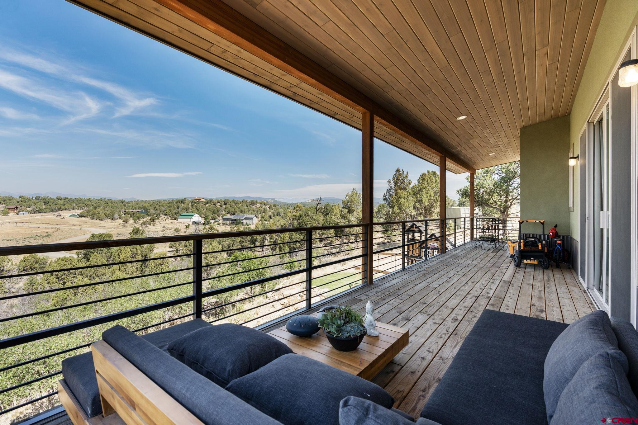 68 Cody Road Durango, CO 81303 - Photo 35 of 45 a view of a balcony with chair and wooden floor