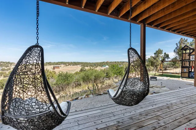 a view of a floor to ceiling window and wooden floor