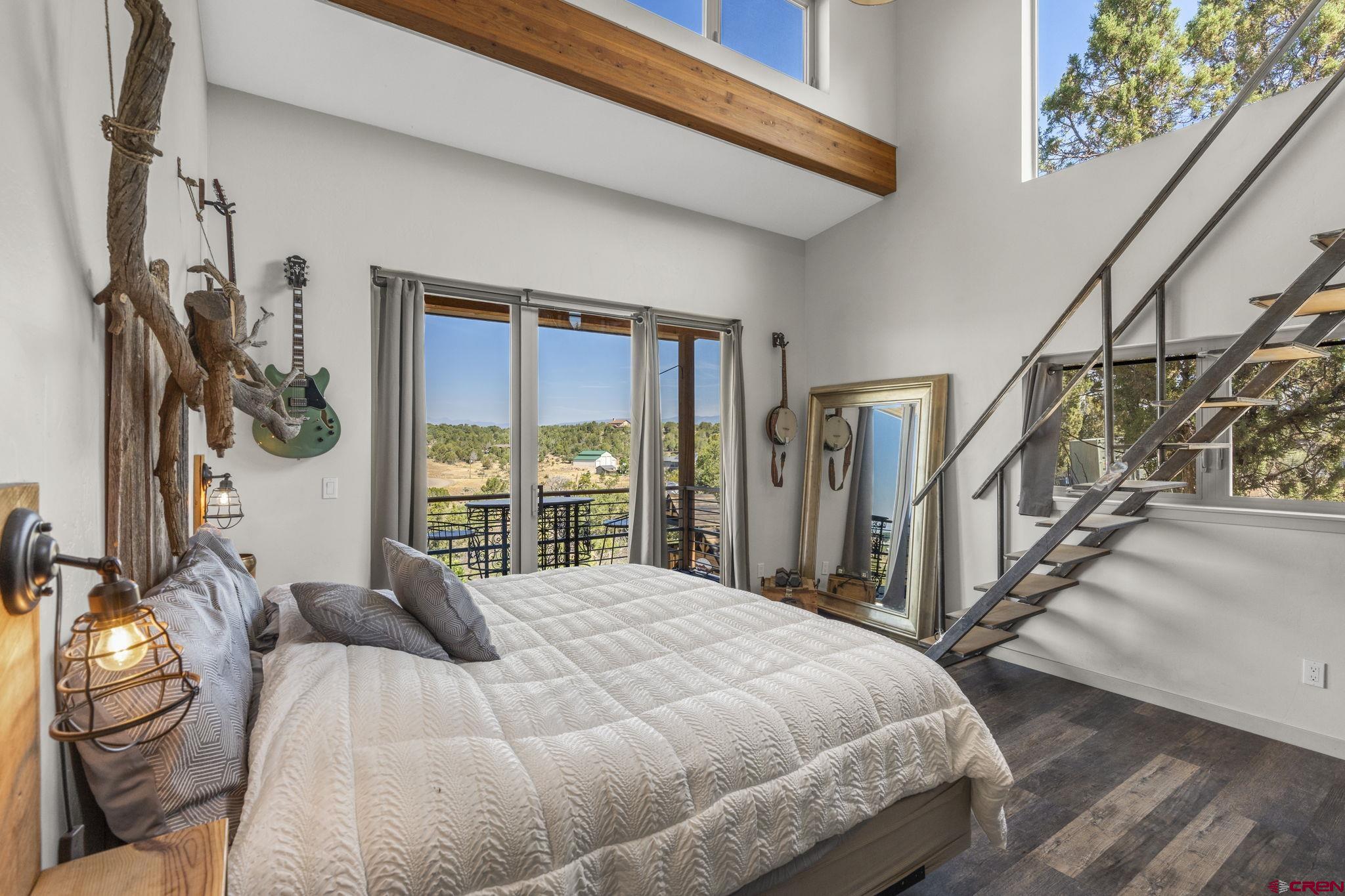 68 Cody Road Durango, CO 81303 - Photo 4 of 45 a bed sitting in a bedroom next to a window