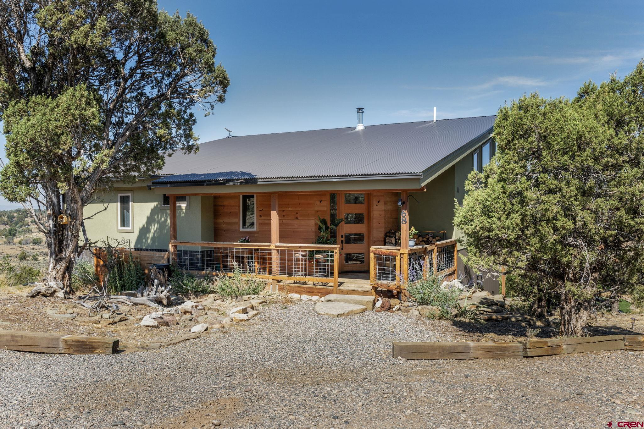 68 Cody Road Durango, CO 81303 - Photo 44 of 45 a house with trees in front of it