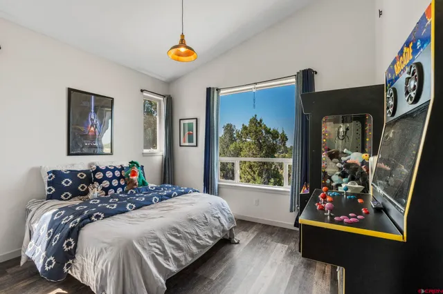 a bedroom with bed and window