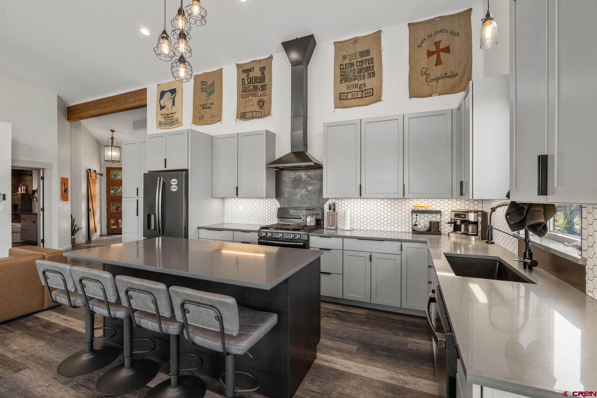 68 Cody Road Durango, CO 81303 - Photo 10 of 45 a kitchen with stainless steel appliances granite countertop a stove refrigerator and cabinets