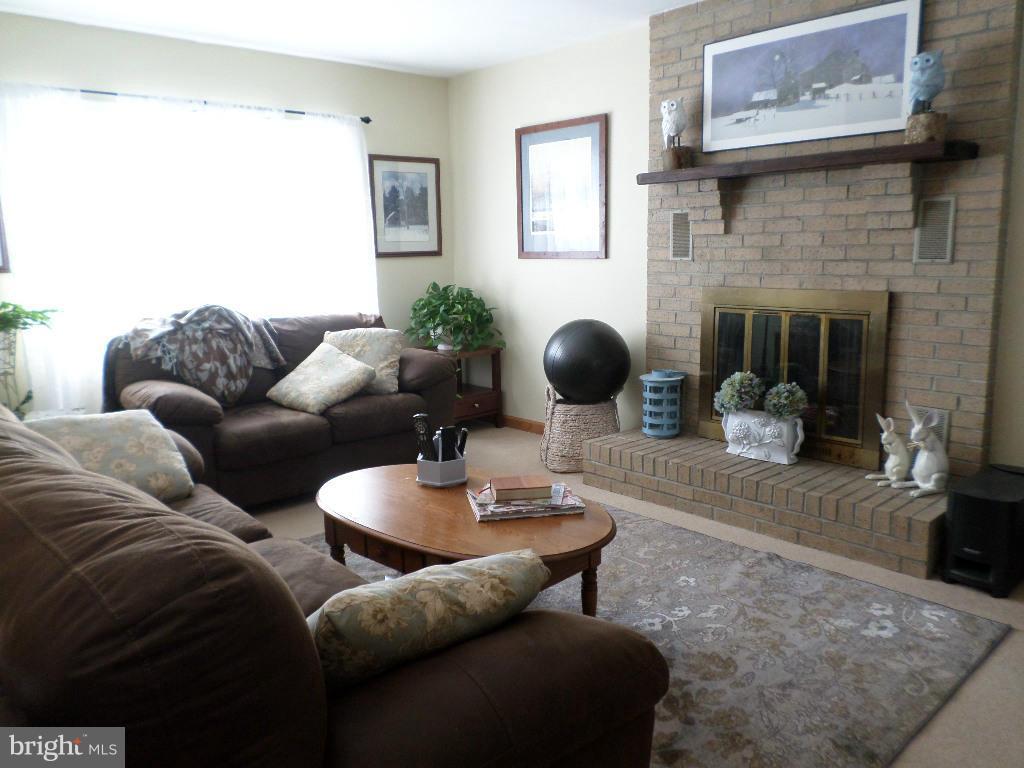 2520 Neudecker Road Westminster, MD 21157 - Photo 2 of 27 a living room with furniture and a fireplace