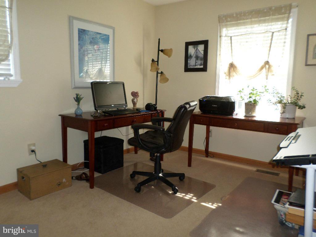 2520 Neudecker Road Westminster, MD 21157 - Photo 12 of 27 a view of a workspace with furniture and a window
