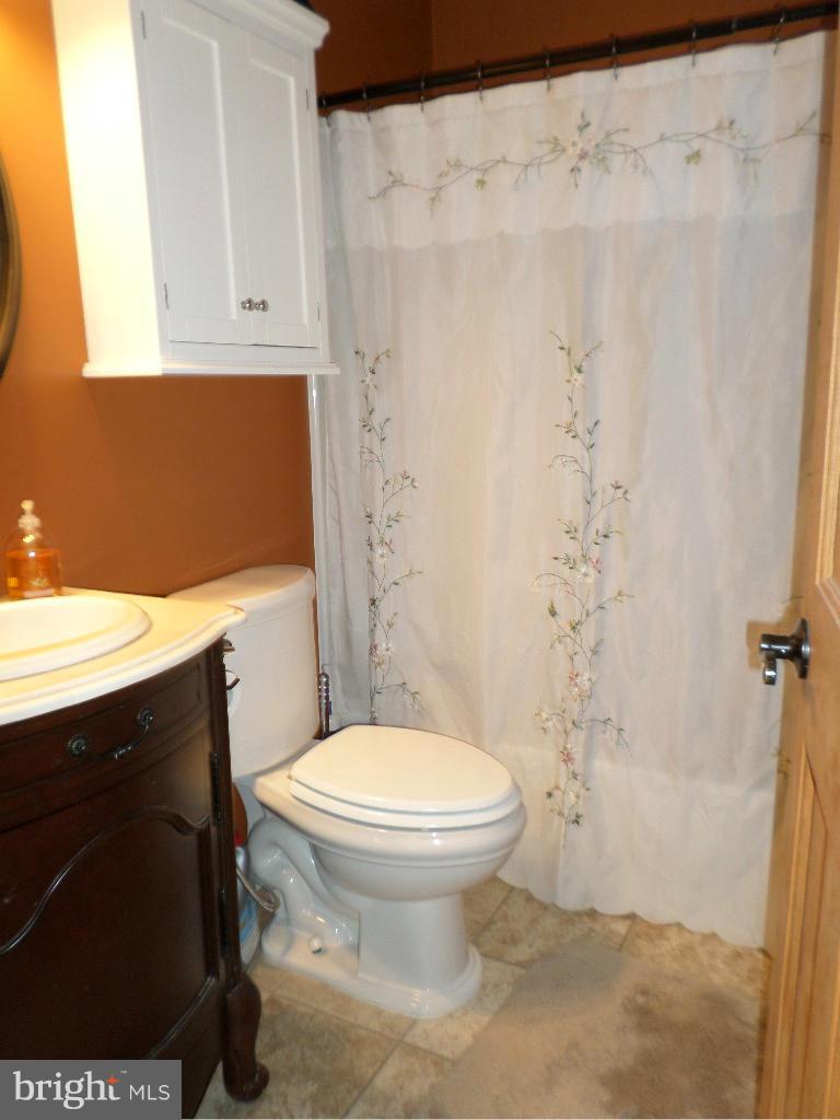 2520 Neudecker Road Westminster, MD 21157 - Photo 14 of 27 a bathroom with a sink toilet and shower