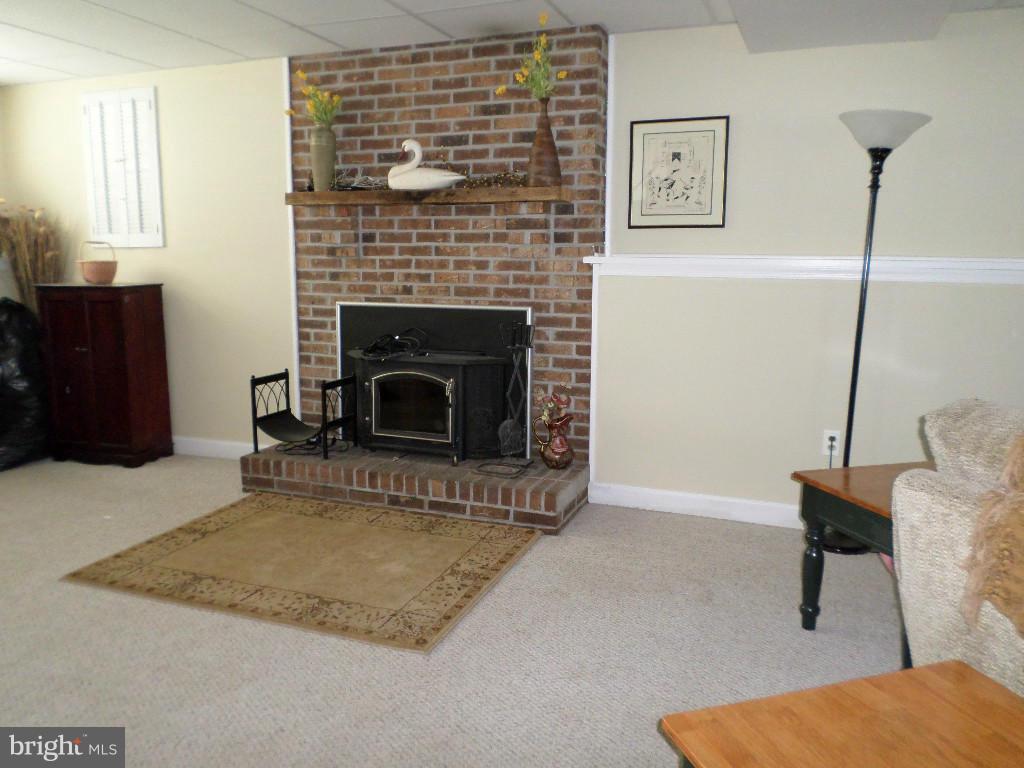2520 Neudecker Road Westminster, MD 21157 - Photo 16 of 27 a living room with furniture and a fireplace