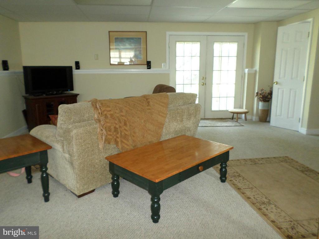 2520 Neudecker Road Westminster, MD 21157 - Photo 17 of 27 a living room with furniture and a flat screen tv