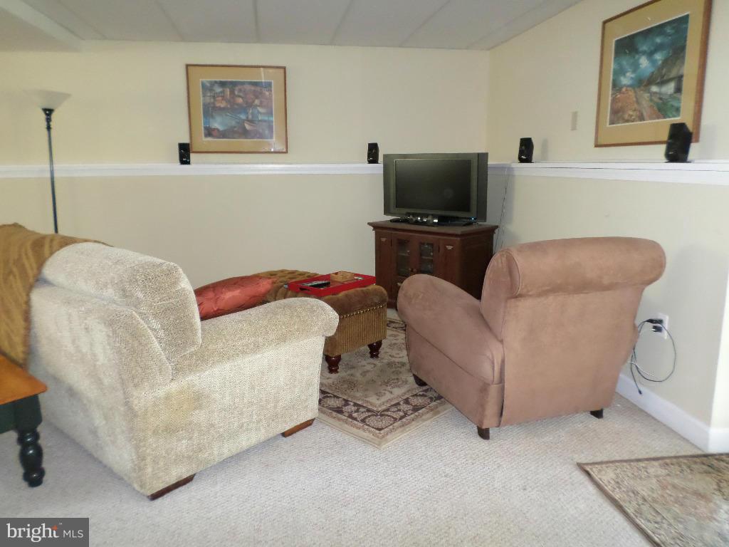 2520 Neudecker Road Westminster, MD 21157 - Photo 18 of 27 a living room with furniture and a flat screen tv