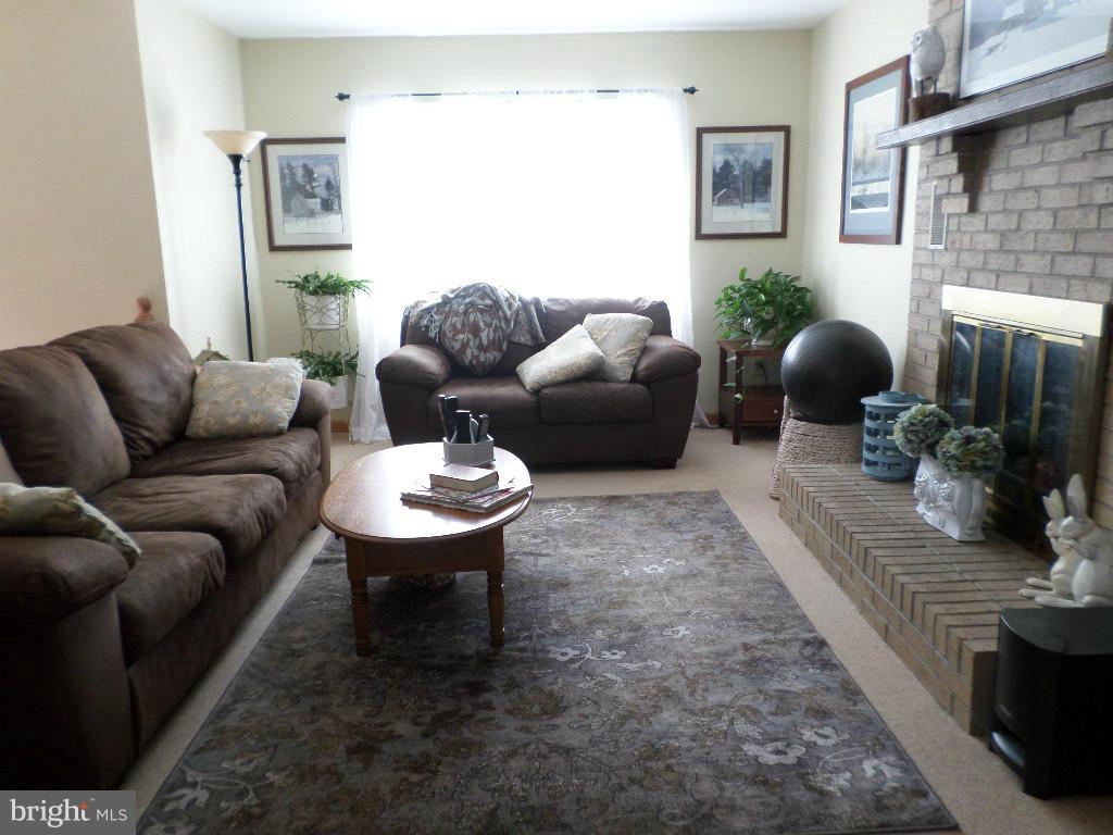 2520 Neudecker Road Westminster, MD 21157 - Photo 3 of 27 a living room with furniture a window and a fireplace
